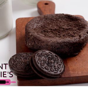 Chocolate cake with Oreo cookies on a wooden board.