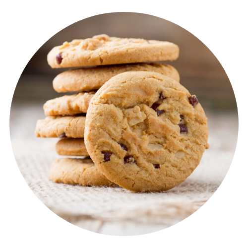 A stack of chocolate chip cookies on top of a table.